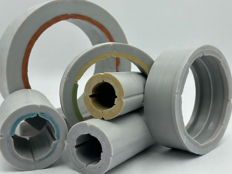 Custom HDPE extrusion profiles featuring specific OD/ID dimensions, co-extruded identification stripes, and UV-stabilized compounds for above-ground industrial applications Custom HDPE extrusion profiles featuring specific OD/ID dimensions, co-extruded identification stripes, and UV-stabilized compounds for above-ground industrial applications